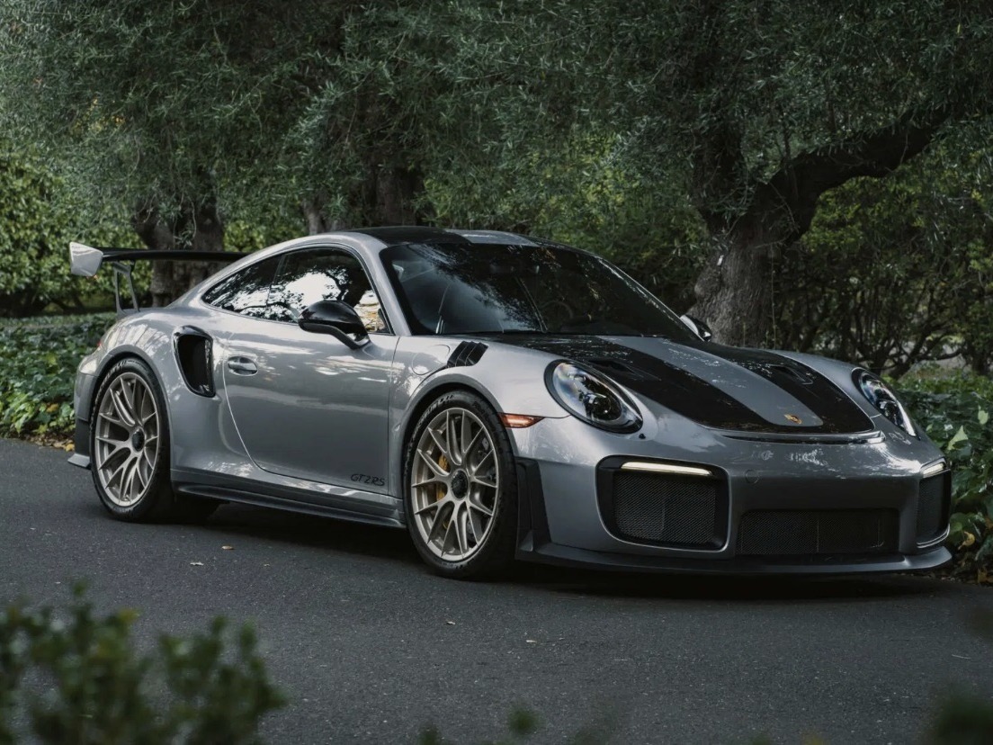 Porsche 911 GT2 RS, silver with black accents, front three-quarter view